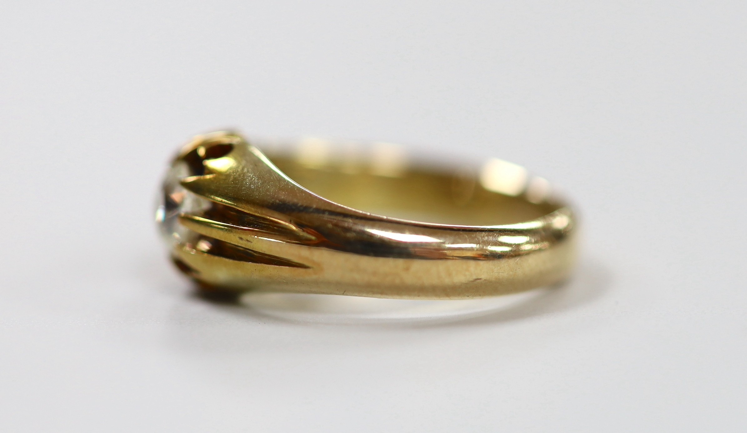 An early 20th century 18ct and claw set solitaire diamond ring, size P, gross weight 7.2 grams